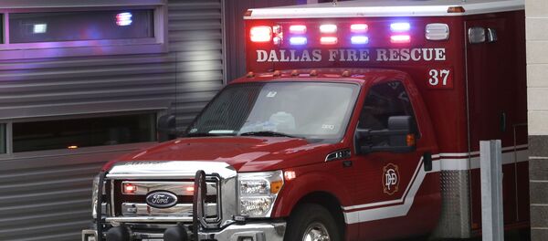 An ambulance pulls into the Dallas Fire-Rescue station 37 in Dallas, Wednesday, Oct. 1, 2014 - Sputnik Afrique