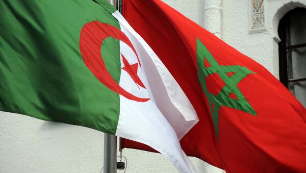 The flags of Algeria (L) and Morocco flutter as Algerian president greets Moroccan Foreign Minister on January 24, 2012 in Algiers. - Sputnik Afrique
