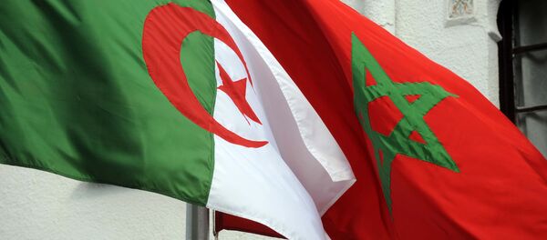 The flags of Algeria (L) and Morocco flutter as Algerian president greets Moroccan Foreign Minister on January 24, 2012 in Algiers. - Sputnik Afrique