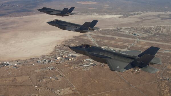 Three F-35 Joint Strike Fighters, (rear to front) AF-2, AF-3 and AF-4, flies over Edwards Air Force Base in this December 10, 2011 handout photo provided by Lockheed Martin - Sputnik Afrique