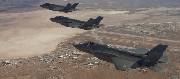 Three F-35 Joint Strike Fighters, (rear to front) AF-2, AF-3 and AF-4, flies over Edwards Air Force Base in this December 10, 2011 handout photo provided by Lockheed Martin - Sputnik Afrique