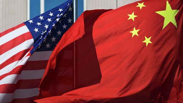U.S. flag and China's flag flutter in winds at a hotel in Beijing Wednesday, Sept. 5, 2012 - Sputnik Afrique