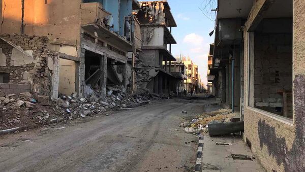 Des bâtiments détruits dans la ville de Homs (archive photo) - Sputnik Afrique