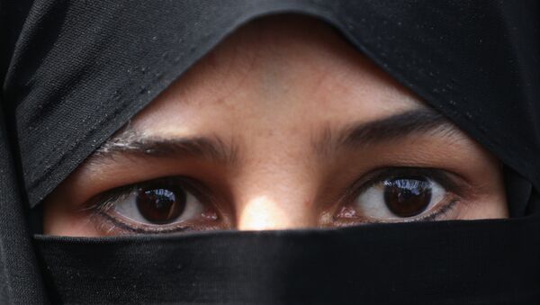 Une femme au niqab - Sputnik Afrique
