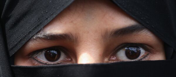 Une femme au niqab Une femme au niqab - Sputnik Afrique