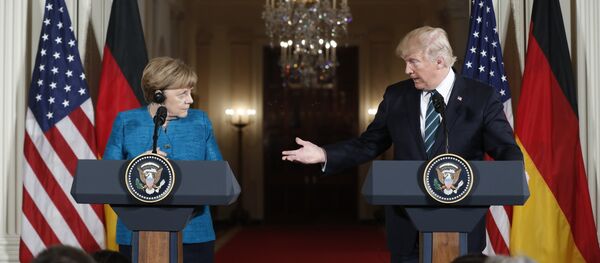President Donald Trump and German Chancellor Angela Merkel participate in a joint news conference in the East Room of the White House in Washington - Sputnik Afrique