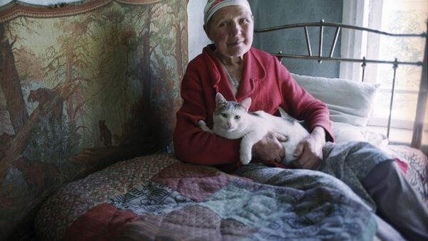 Une vieille dame au chat - Sputnik Afrique