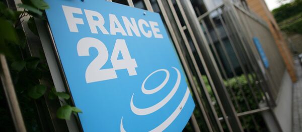 A picture taken on May 3, 2011 in Issy-Les-Moulineaux, a south-western Paris suburb, shows the logo of French International news TV channel France 24 at the headquarters entrance. - Sputnik Afrique