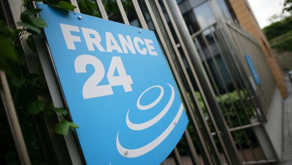 A picture taken on May 3, 2011 in Issy-Les-Moulineaux, a south-western Paris suburb, shows the logo of French International news TV channel France 24 at the headquarters entrance. - Sputnik Afrique