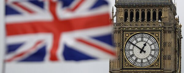 a British flag is blown by the wind near to Big Ben's clock tower in front of the UK Houses of Parliament in central London - Sputnik Afrique