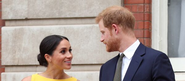 Le prince Harry et son épouse Meghan - Sputnik Afrique