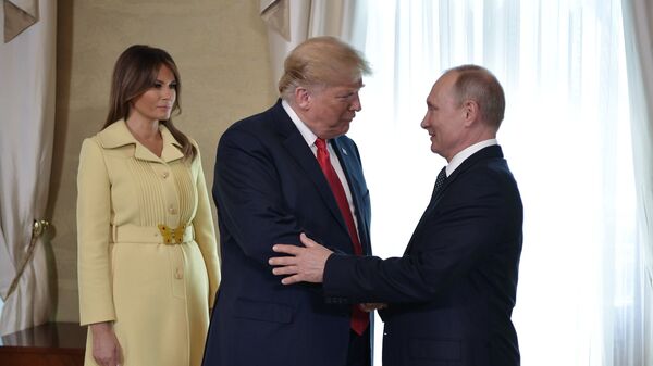 July 16, 2018. Russian President Vladimir Putin and US President Donald Trump, center, with his wife, Melania, during a meeting at the Presidential Palace in Helsinki. - Sputnik Africa