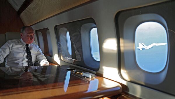 Vladimir Poutine dans son avion - Sputnik Afrique