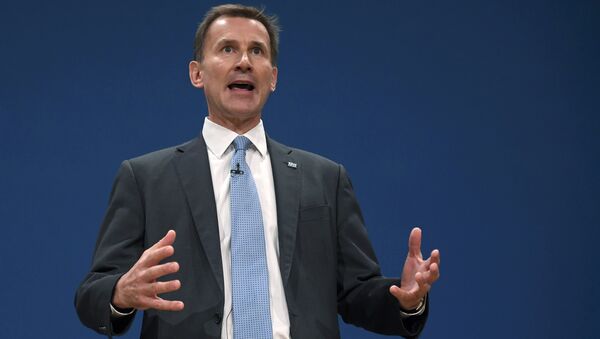 Britain's Health Secretary Jeremy Hunt delivers his keynote address at the annual Conservative Party Conference in Birmingham, Britain, October 4, 2016. - Sputnik Afrique