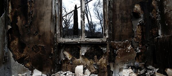 The interior of a burnt house is seen following a wildfire in the village of Mati, near Athens - Sputnik Afrique