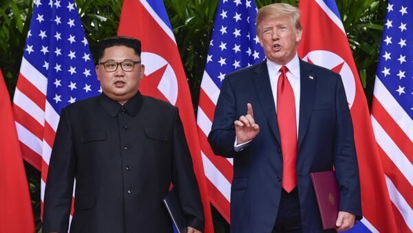 FILE - In this June 12, 2018, file photo, U.S. President Donald Trump makes a statement before saying goodbye to North Korea leader Kim Jong Un after their meetings at the Capella resort on Sentosa Island in Singapore - Sputnik Afrique