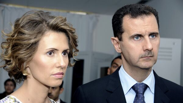 Präsident Baschar al-Assad mit seiner Gattin Asma (Archivbild) - Sputnik Afrique