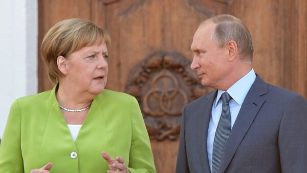  Angela Merkel et Vladimir Poutine (archive photo) - Sputnik Afrique