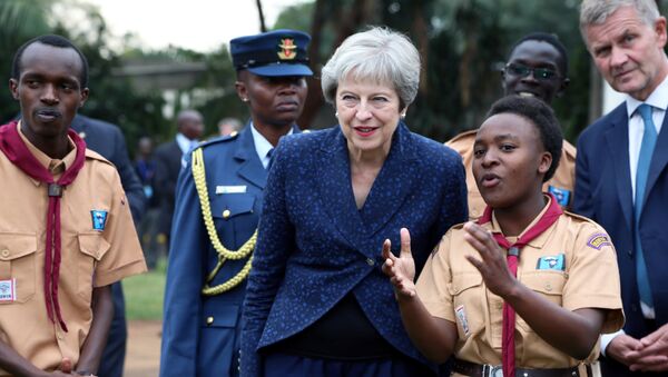 Britain's Prime Minister Theresa May listens to a presentation during her visit to the United Nations complex within Gigiri in Nairobi, Kenya August 30, 2018. - Sputnik Afrique