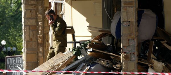 Ситуация на месте взрыва в донецком кафе Сепар Ситуация на месте взрыва в донецком кафе Сепар - Sputnik Afrique