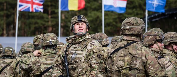 US soldiers are pictured prior the beginning of the official welcoming ceremony of NATO troops in Orzysz, Poland, on April 13, 2017. - Sputnik Afrique