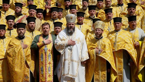 Clergymen of Ukrainian Orthodox Church of the Kiev Patriarchate take part in a ceremony marking the 1030th anniversary of the Christianisation of the country, which was then known as Kievan Rus', in Kiev, Ukraine July 28, 2018. - Sputnik Afrique