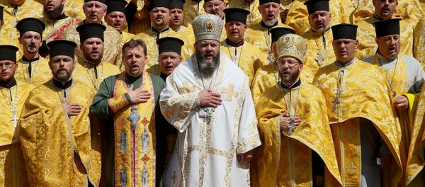 Clergymen of Ukrainian Orthodox Church of the Kiev Patriarchate take part in a ceremony marking the 1030th anniversary of the Christianisation of the country, which was then known as Kievan Rus', in Kiev, Ukraine July 28, 2018. - Sputnik Afrique