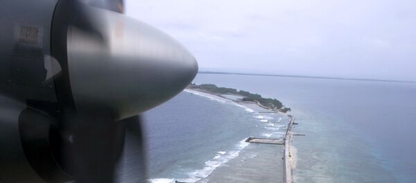A picture shows an aerial view of the Moruroa (Mururoa) atoll, where French forces have conducted 138 nuclear weapon tests until 1996, in Moruroa, southern Pacific ocean, February 13, 2014. - Sputnik Afrique
