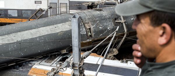 This picture taken on October 16, 2018 shows the scene of a rail accident in the Moroccan town of Bouknadel, between the capital Rabat and the port city of Kenitra to its north. - Sputnik Afrique
