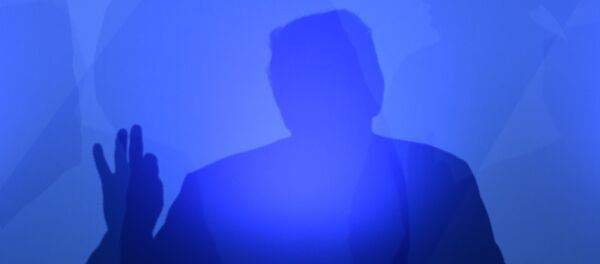 US President Donald Trump casts a shadow as he addresses a press conference on the second day of the North Atlantic Treaty Organization (NATO) summit in Brussels on July 12, 2018. - Sputnik Afrique