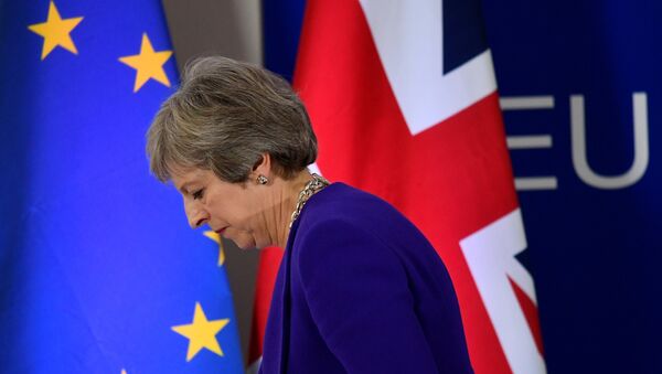 FILE PHOTO: Britain's Prime Minister Theresa May leaves a news conference at the European Union leaders summit in Brussels, Belgium October 18, 2018. REUTERS/Toby Melville/File Photo - Sputnik Afrique