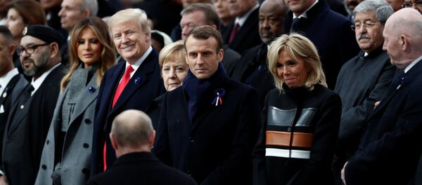 Russian President Vladimir Putin arrives to take his place with French President Emmanuel Macron, Brigitte Macron, German Chancellor Angela Merkel, U.S. President Donald Trump and first lady Melania Trump to attend a commemoration ceremony for Armistice Day, 100 years after the end of the First World War at the Arc de Triomphe in Paris, France, November 11, 2018. - Sputnik Afrique