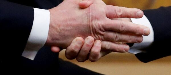 U.S. President Donald Trump shakes hands with French President Emmanuel Macron as they meet at Elysee presidential palace, as part of the commemoration ceremony for Armistice Day, 100 years after the end of the First World War, in Paris, France, November 10, 2018. U.S. President Donald Trump shakes hands with French President Emmanuel Macron as they meet at Elysee presidential palace, as part of the commemoration ceremony for Armistice Day, 100 years after the end of the First World War, in Paris, France, November 10, 2018. - Sputnik Afrique