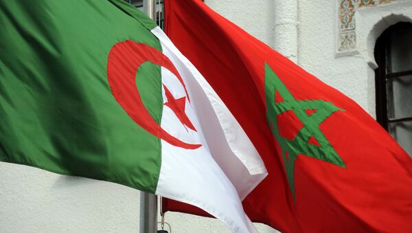 The flags of Algeria (L) and Morocco flutter as Algerian president greets Moroccan Foreign Minister on January 24, 2012 in Algiers. - Sputnik Afrique