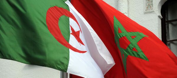 The flags of Algeria (L) and Morocco flutter as Algerian president greets Moroccan Foreign Minister on January 24, 2012 in Algiers. - Sputnik Afrique