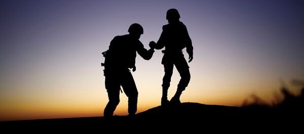 Israeli soldiers are seen next to the border fence between Israel and the Gaza Strip as Palestinians protest on the Gaza side of the border, Israel November 2, 2018. - Sputnik Afrique