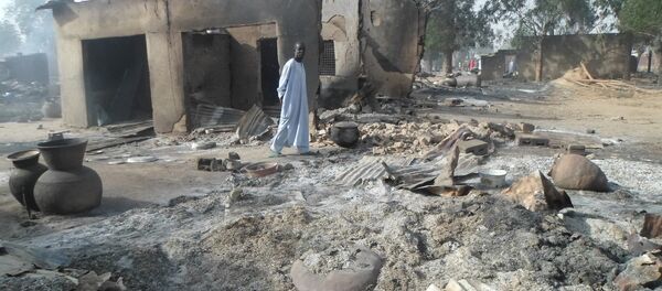 Un village nigérian attaqué par Boko Haram (archive photo) Un village nigérian attaqué par Boko Haram (archive photo) - Sputnik Afrique