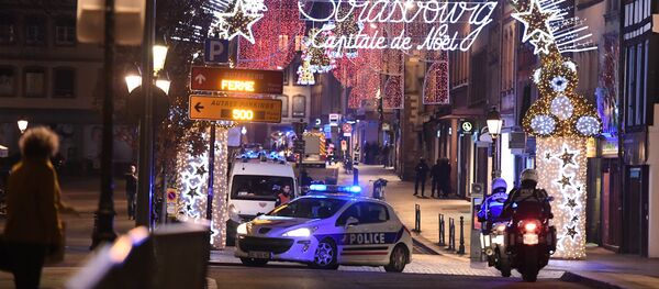 A police car drives in the streets of Strasbourg, eastern France, after a shooting breakout, on December 11, 2018 - Sputnik Afrique