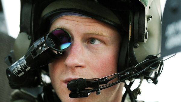 In this Dec. 12, 2012 file photo, Prince Harry wears his monocle gun sight as he sits in the front seat of his cockpit at the British controlled flight-line, in Camp Bastion, southern Afghanistan. - Sputnik Afrique