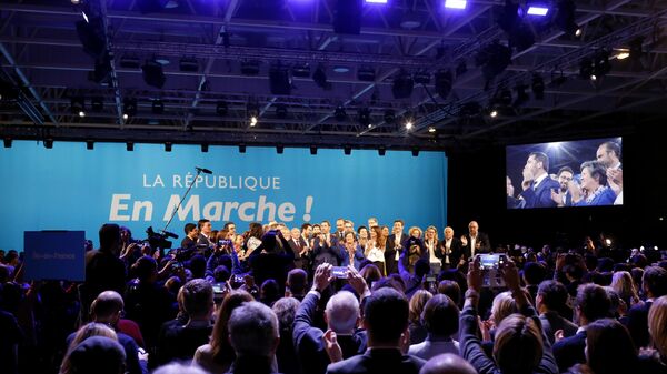 A close ally of French President Emmanuel Macron, Christophe Castaner, center, stands on the scene with his colleagues after being elected delegate general of French president's new centrist party, La Republique en Marche (The Republic on the Move, LREM), during a party convention in Chassieu, near Lyon, central France, Saturday, Nov. 18, 2017. - Sputnik Afrique