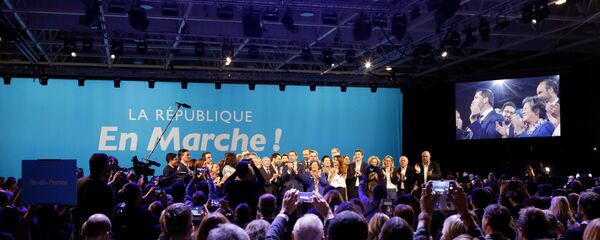 A close ally of French President Emmanuel Macron, Christophe Castaner, center, stands on the scene with his colleagues after being elected delegate general of French president's new centrist party, La Republique en Marche (The Republic on the Move, LREM), during a party convention in Chassieu, near Lyon, central France, Saturday, Nov. 18, 2017. - Sputnik Afrique