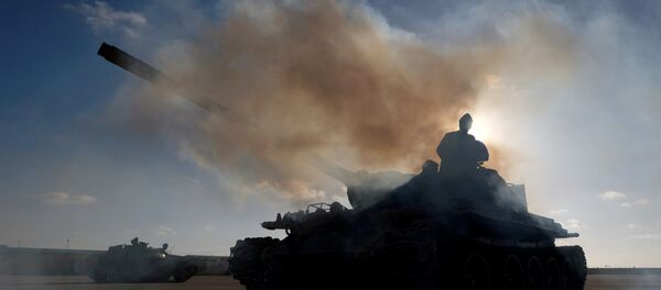 FILE PHOTO: Members of Libyan National Army (LNA) commanded by Khalifa Haftar, get ready before heading out of Benghazi to reinforce the troops advancing to Tripoli, in Benghazi - Sputnik Afrique