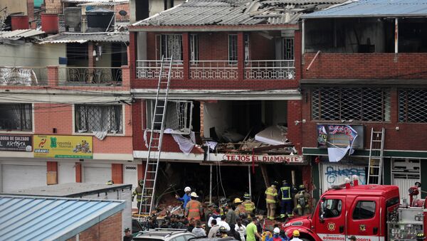 Firemen work following an explosion in a house where was a powder factory, in Bogota - Sputnik Afrique