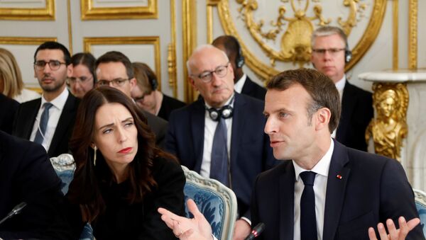 French President Emmanuel Macron (R) and New Zealand's Prime Minister Jacinda Ardern (L) attend a launching ceremony for the 'Christchurch call', an initiative pushed by Ardern after a self-described white supremacist gunned down 51 people in a massacre at two mosques in the New Zealand city in March, at the Elysee Palace in Paris, on May 15, 2019. - French President  and New Zealand's premier host other world leaders and leading tech chiefs to launch an ambitious new initiative aimed at curbing extremism online. The political meeting will run in parallel to an initiative launched by Macron called Tech for Good which will bring together 80 tech chiefs in Paris to find a way for new technologies to work for the common good.  - Sputnik Afrique