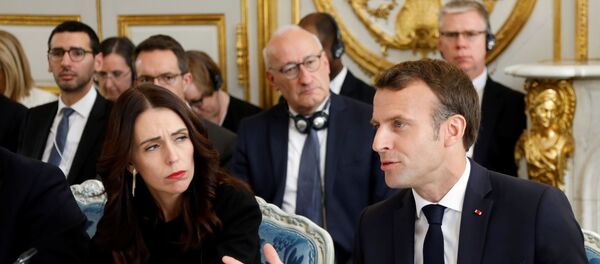 French President Emmanuel Macron (R) and New Zealand's Prime Minister Jacinda Ardern (L) attend a launching ceremony for the 'Christchurch call', an initiative pushed by Ardern after a self-described white supremacist gunned down 51 people in a massacre at two mosques in the New Zealand city in March, at the Elysee Palace in Paris, on May 15, 2019. - French President  and New Zealand's premier host other world leaders and leading tech chiefs to launch an ambitious new initiative aimed at curbing extremism online. The political meeting will run in parallel to an initiative launched by Macron called Tech for Good which will bring together 80 tech chiefs in Paris to find a way for new technologies to work for the common good.  - Sputnik Afrique