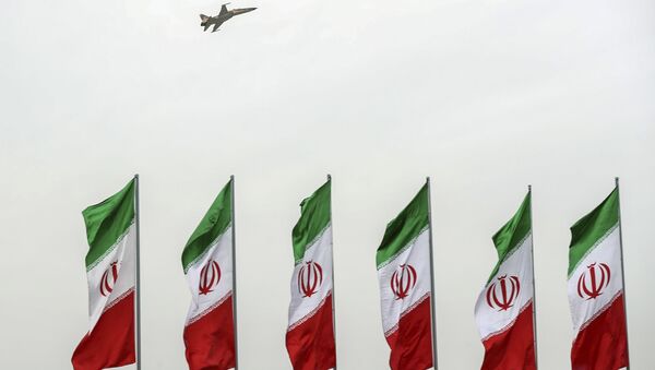 In this photo released by the official website of the office of the Iranian Presidency, a fighter jet flies over Iranian flags during the army parade commemorating National Army Day in front of the shrine of the late revolutionary founder Ayatollah Khomeini, just outside Tehran, Iran, Thursday, April 18, 2019 - Sputnik Afrique