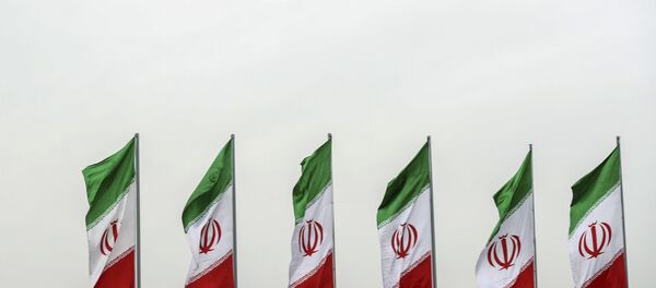 In this photo released by the official website of the office of the Iranian Presidency, a fighter jet flies over Iranian flags during the army parade commemorating National Army Day in front of the shrine of the late revolutionary founder Ayatollah Khomeini, just outside Tehran, Iran, Thursday, April 18, 2019 - Sputnik Afrique