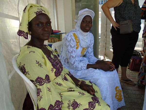 Coura Soumaré (G) et Marie Sarr (D), transformatrices sénégalaises de produits laitiers, à Dakar, lors de la célébration de la Journée mondiale du lait, le 1er juin 2019. Coura Soumaré (G) et Marie Sarr (D), transformatrices sénégalaises de produits laitiers, à Dakar, lors de la célébration de la Journée mondiale du lait, le 1er juin 2019. - Sputnik Afrique