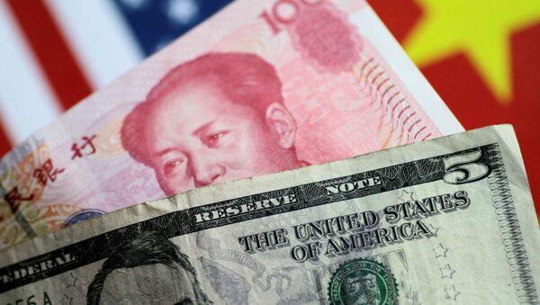U.S. dollar and Chinese yuan notes are seen in this picture illustration June 2, 2017 - Sputnik Afrique