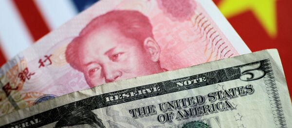 U.S. dollar and Chinese yuan notes are seen in this picture illustration June 2, 2017 - Sputnik Afrique